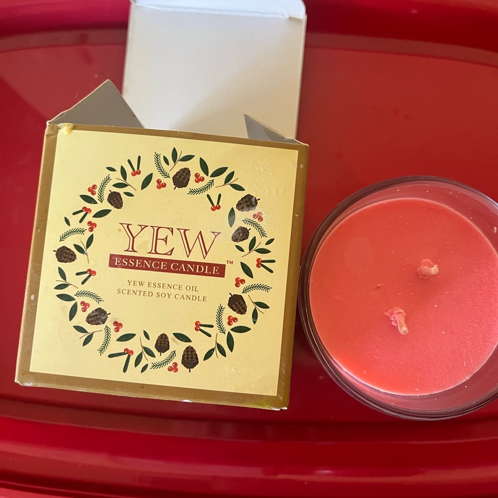 YEW Rose scented soy infused essential oil candle.